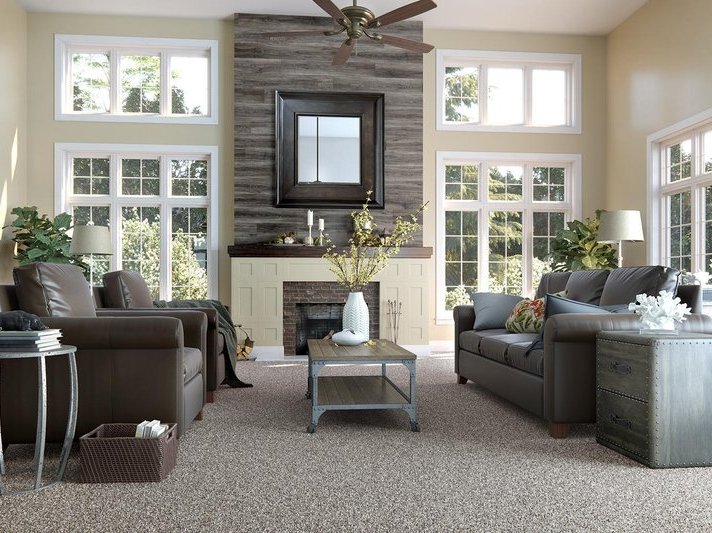 Living room with laminate flooring feature wall above fireplace